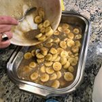 Adding the bananas foster sauce to the pan, taken by Allspice Photography, LLC.