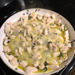 Sautéing the chicken and garlic in the pan, taken by Allspice Photography, LLC.