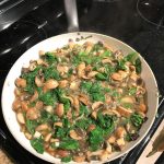 Sautéing the spinach and mushrooms in the pan, taken by Allspice Photography, LLC.