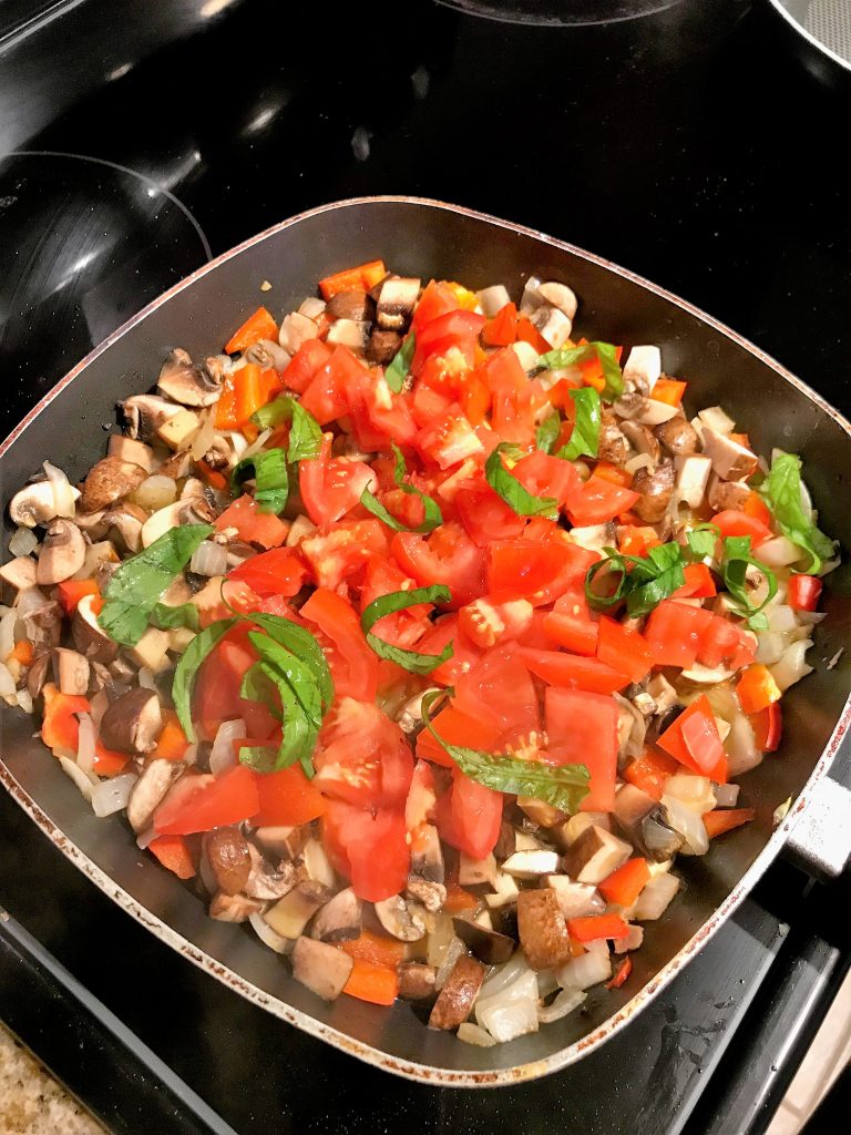 Sautéing the veggies for the breakfast burritos. Taken by Allspice Photography, LLC.