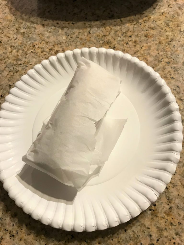 A freezer-prepped, breakfast burrito, ready to go. Taken by Allspice Photography, LLC.