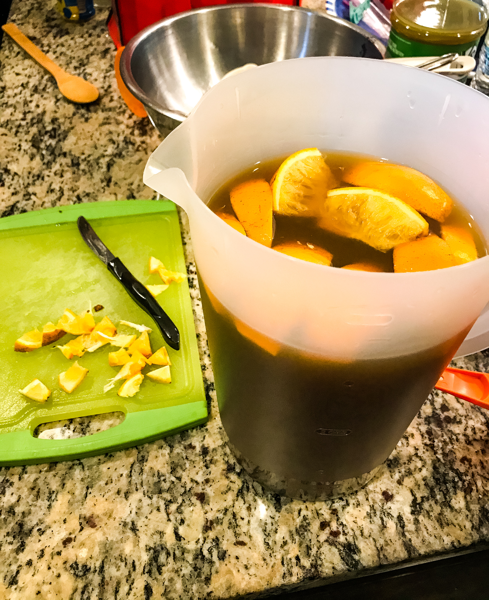 Cutting up fruit for the tea, taken by Allspice Photography, LLC.