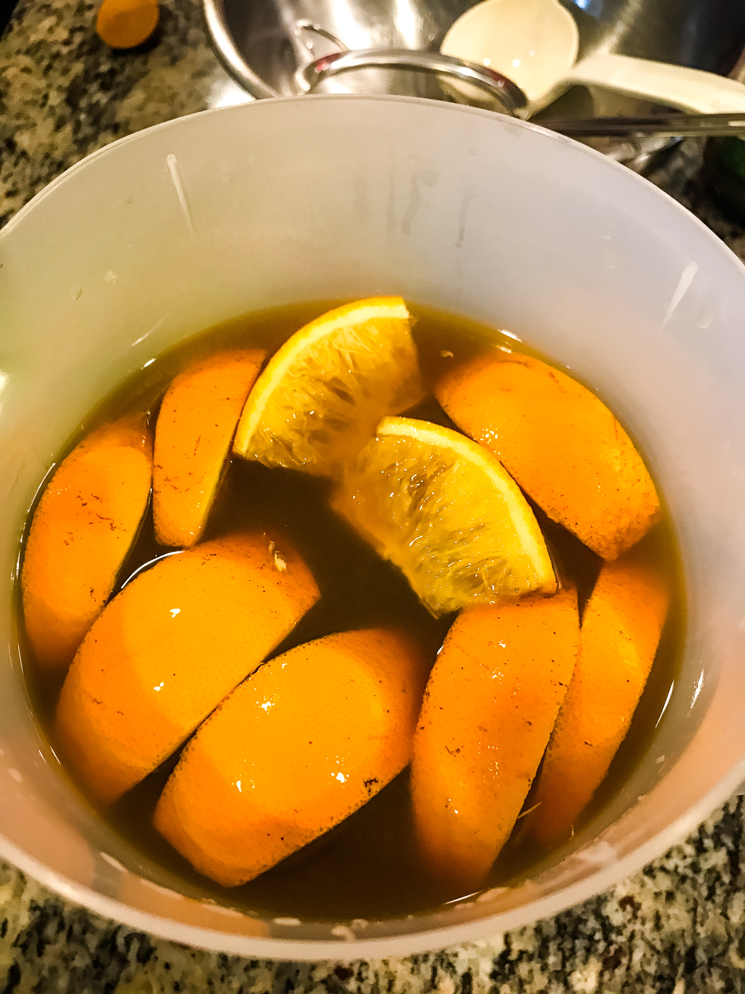 The oranges stewing in the Tropical Tanager Tea, taken by Allspice Photography, LLC.