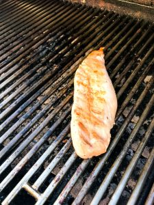 Grilling the pork with carnitas marinade on the grill, taken by Allspice Photography, LLC.