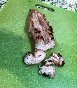 Slicing into the marinaded pork, taken by Allspice Photography, LLC.