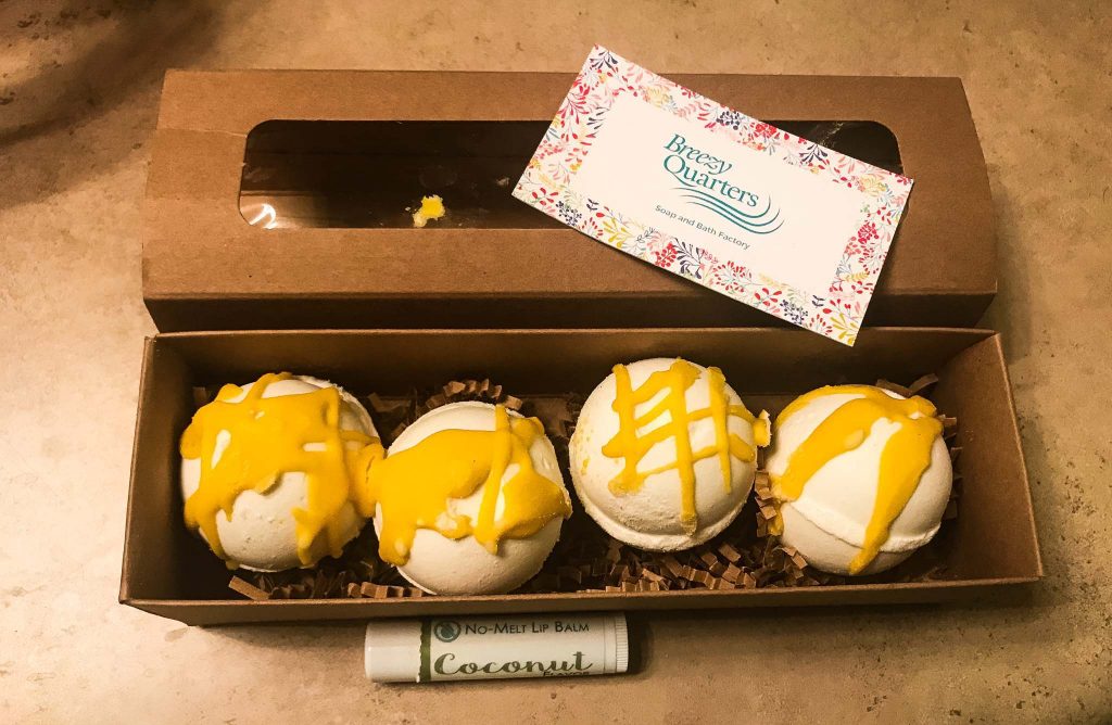 Of course I had to try the lip balm on her recommendation (coconut flavor for me) and some bath bombs that smelled like lemon drops (I believe they were called "Sunshine")!