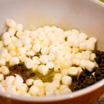 Adding in the chocolate chips, marshmallows, and vanilla extract. Taken by Allspice Photography, LLC.