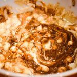 Stirring together the chocolate chips, marshmallows, and vanilla extract. Taken by Allspice Photography, LLC.
