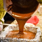 Pouring the finished dairy-free microwave fudge into a pan. Taken by Allspice Photography, LLC.