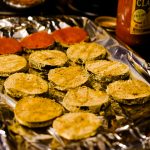 Setting up the baked eggplant disks and topping them with sauce before baking again, taken by Allspice Photography LLC.