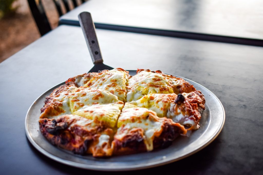 Breakfast Lovers pizza from Myles Pizza Pub in Greenville, SC, taken by Allspice Photography, LLC.