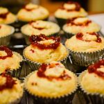 After letting the cupcakes cool, we cut out the little cores and filled them with the cranberry compote. Taken by Allspice Photography, LLC.
