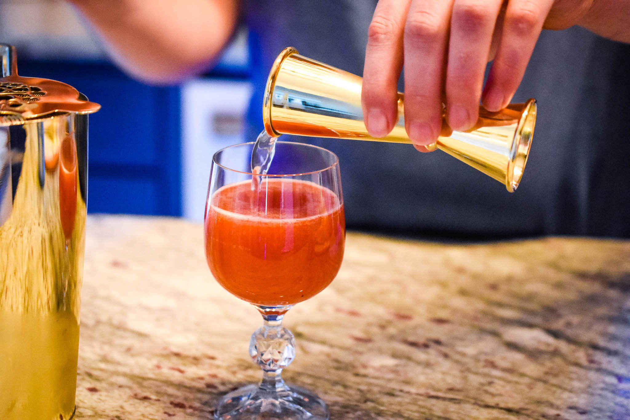 Once we mix the peach nectar and strawberry purée together, we add the sparkling lemon water to The Summer Berry mocktail for some citrus and bubbly elements! Taken by Allspice Photography, LLC.