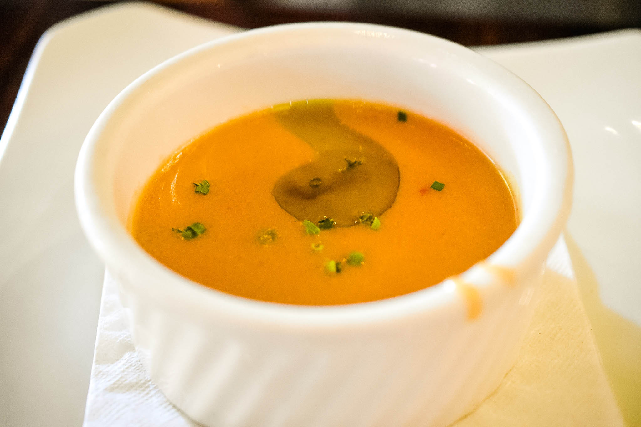 Lobster bisque with chives and basil oil from Passerelle Bistro in downtown Greenville, SC.