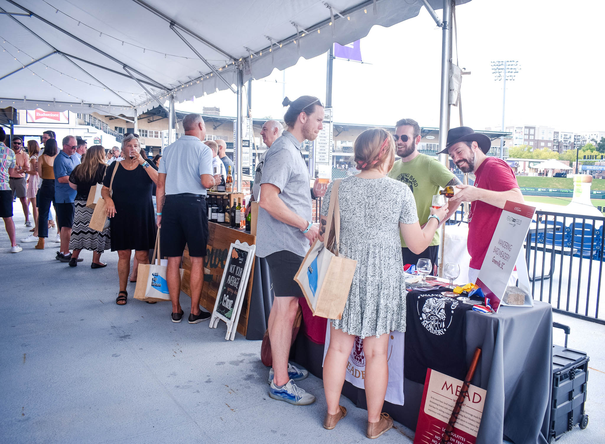People enjoying the Wine Club at Feast by the Field in downtown Greenville, SC.