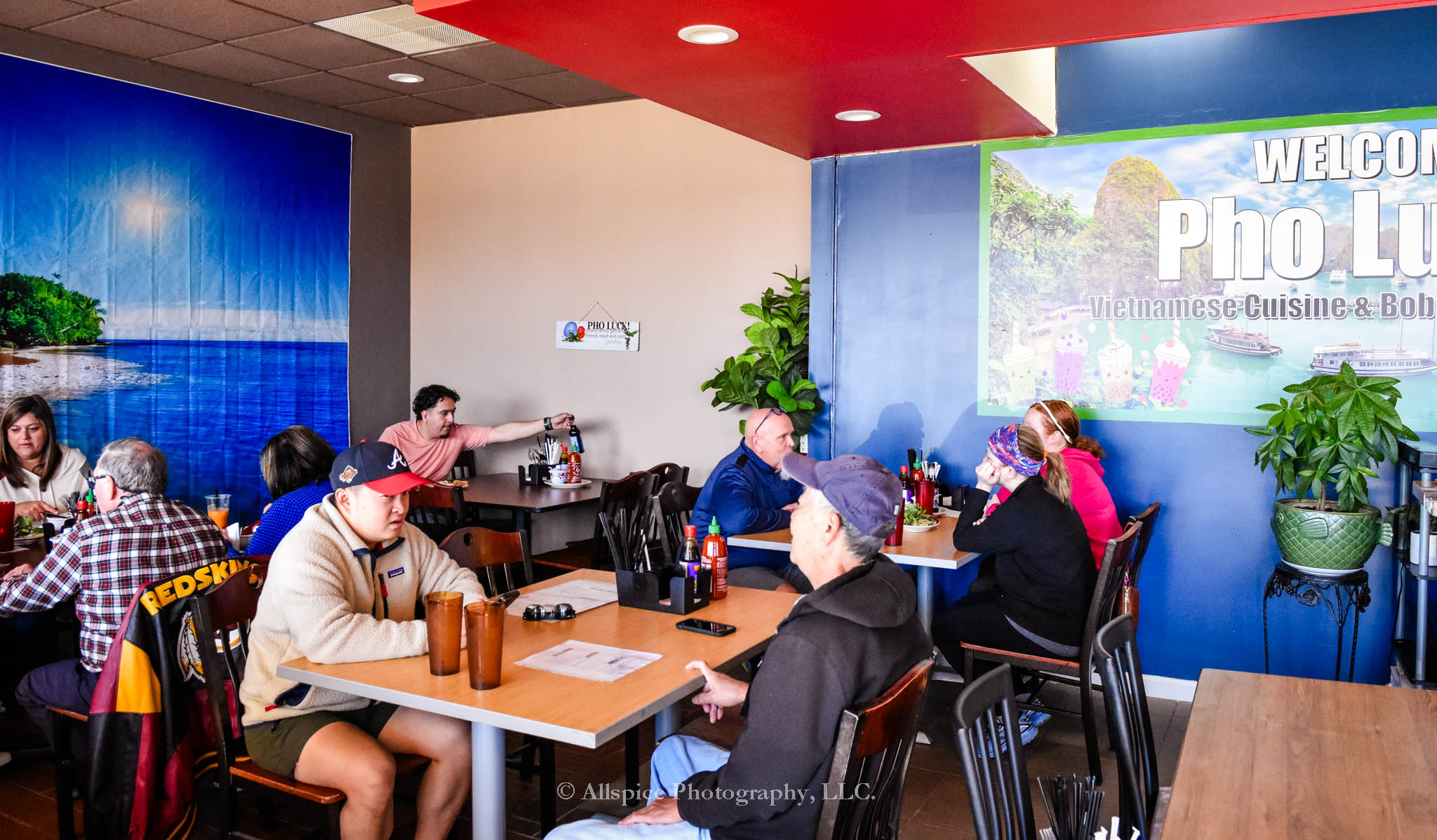 Diners enjoying their meal at Pho Luck! Restaurant in Wellford, SC, taken by Allspice Photography, LLC.