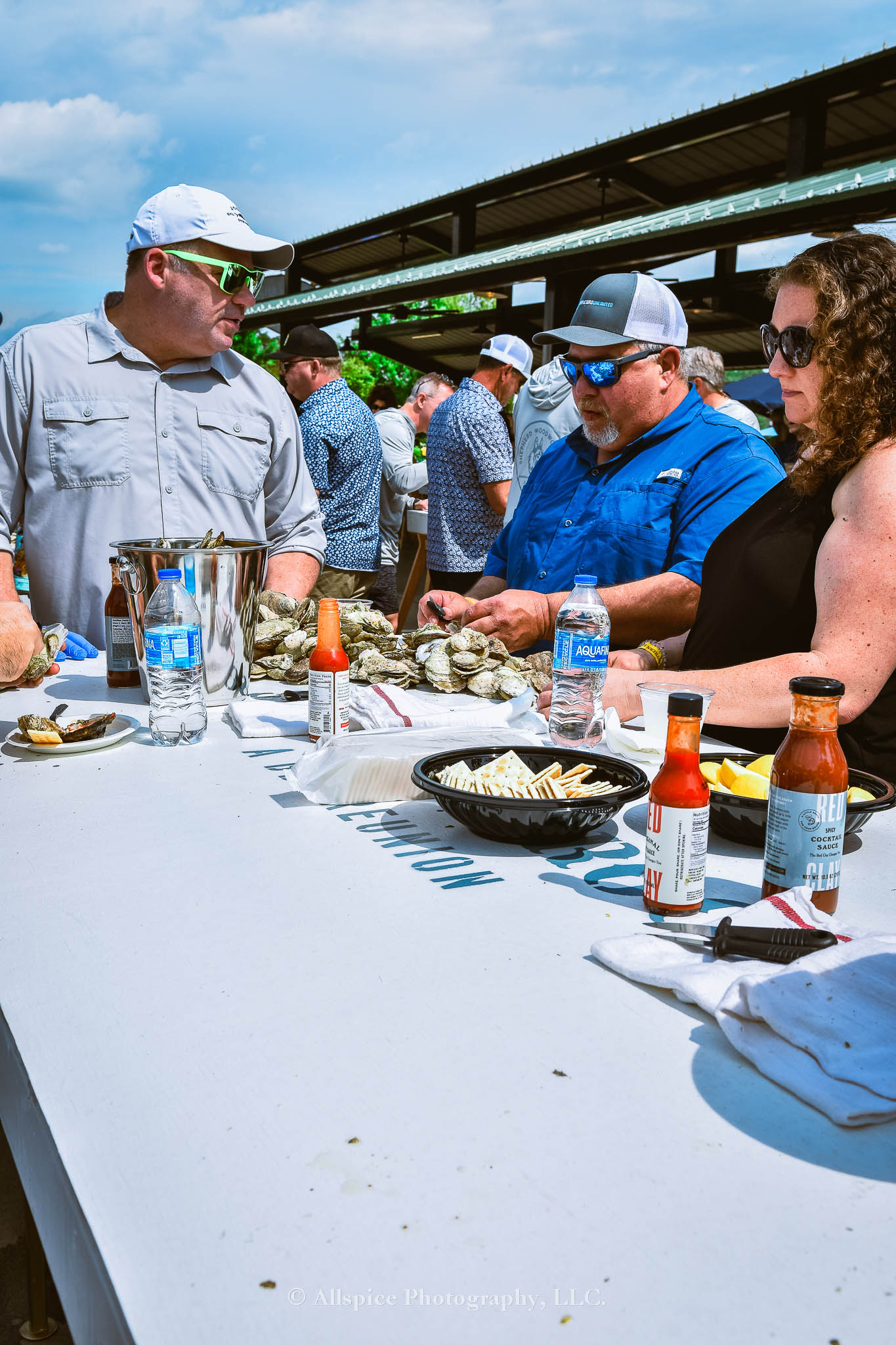 Folks enjoying the Oyster Roast from the VIP section of Southern Roots Reunion 2024. Taken by Allspice Photography, LLC.