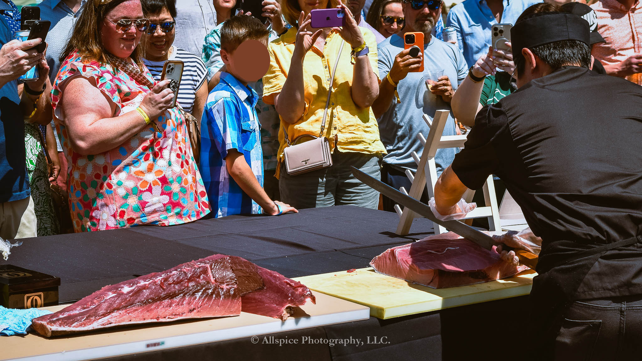 Watching the Live Tuna Cutting from Sushi Yama Travelers Rest at Souther Roots Reunion. Taken by Allspice Photography, LLC.