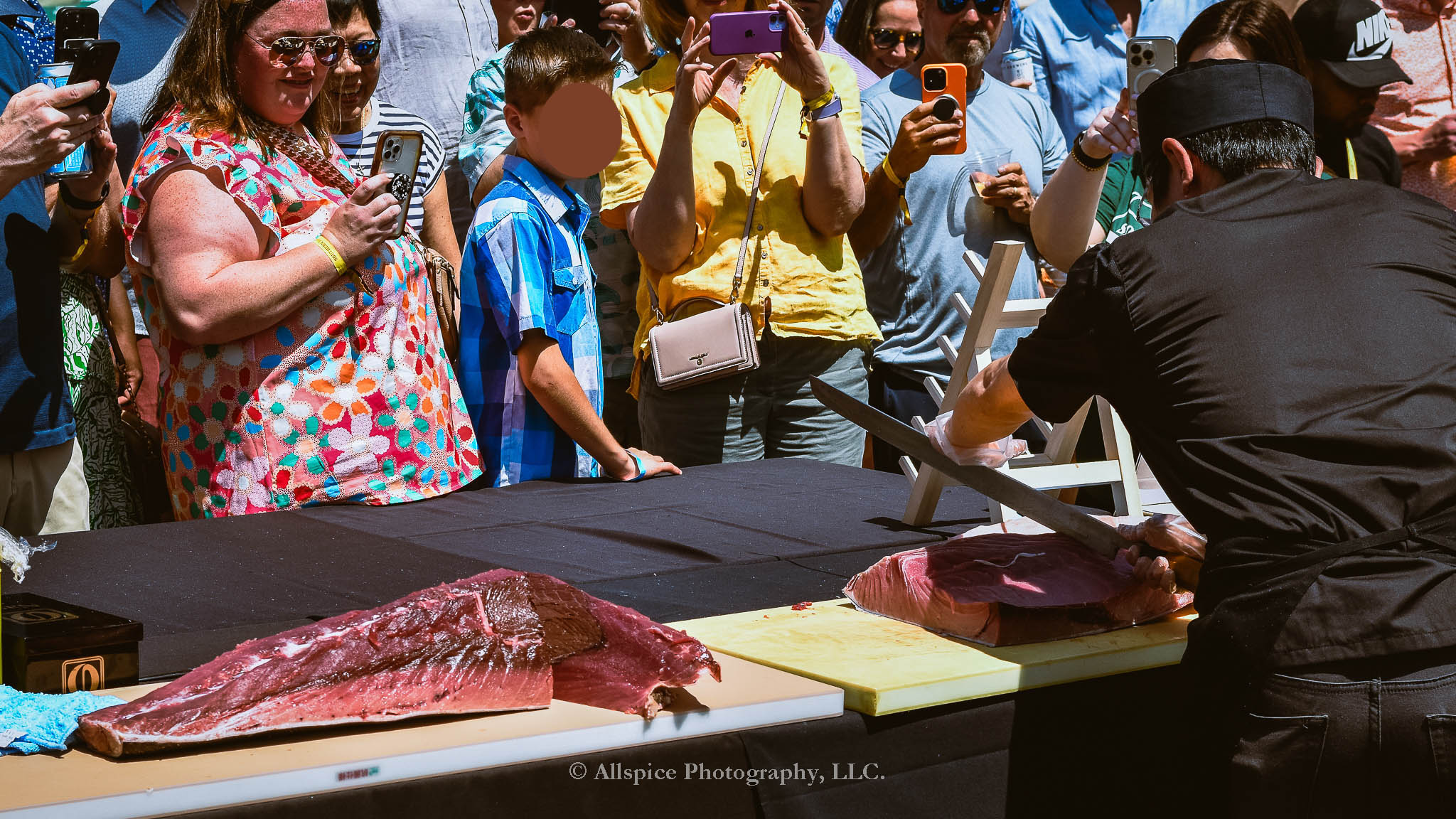 Watching the Live Tuna Cutting from Sushi Yama Travelers Rest at Souther Roots Reunion. Taken by Allspice Photography, LLC.