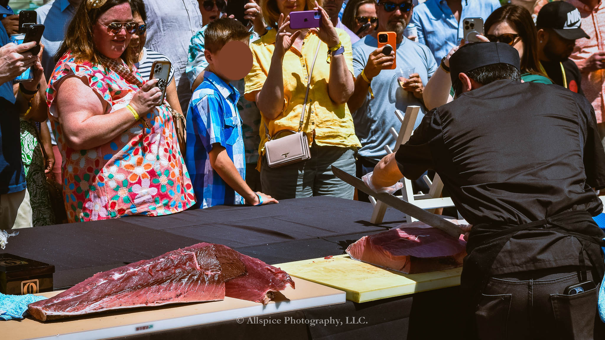 Watching the Live Tuna Cutting from Sushi Yama Travelers Rest at Souther Roots Reunion. Taken by Allspice Photography, LLC.