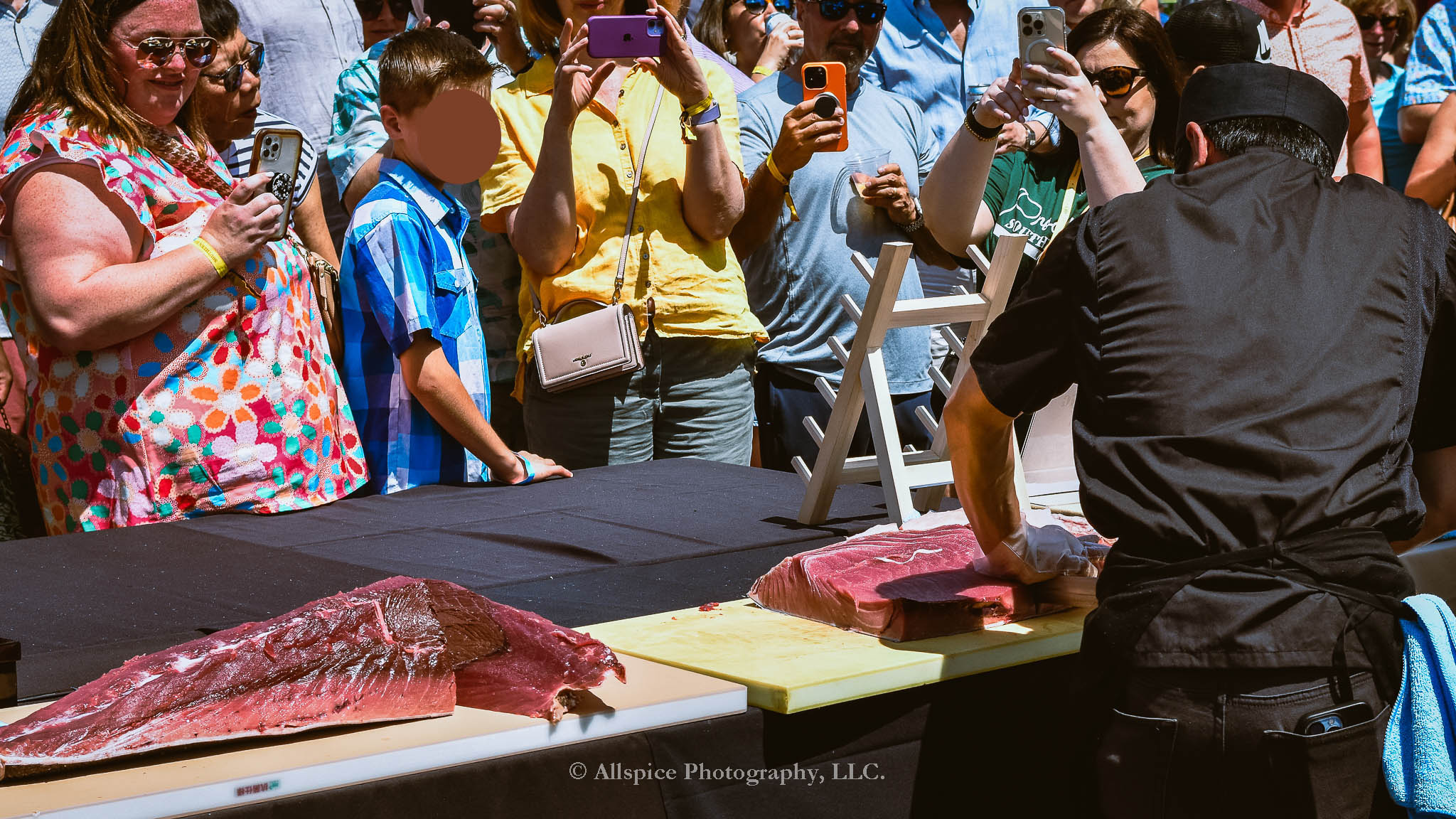 Watching the Live Tuna Cutting from Sushi Yama Travelers Rest at Souther Roots Reunion. Taken by Allspice Photography, LLC.