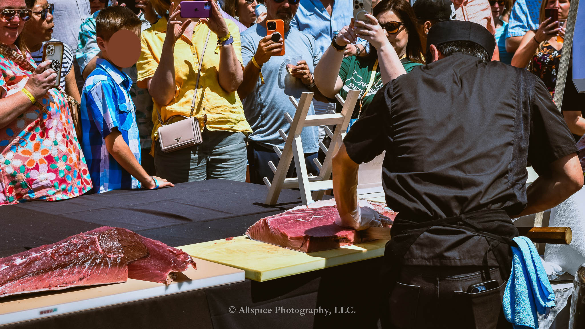 Watching the Live Tuna Cutting from Sushi Yama Travelers Rest at Souther Roots Reunion. Taken by Allspice Photography, LLC.