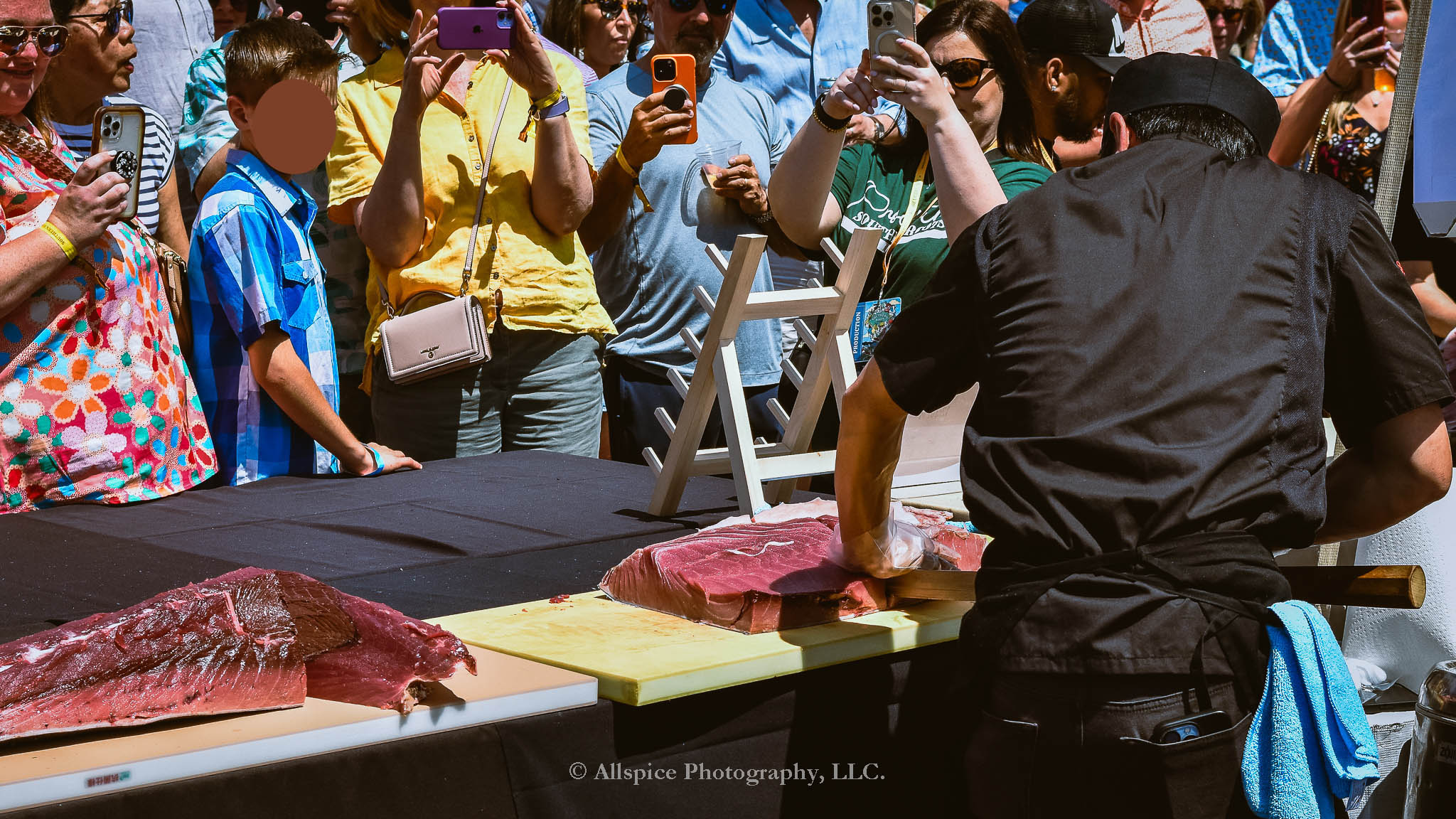 Watching the Live Tuna Cutting from Sushi Yama Travelers Rest at Souther Roots Reunion. Taken by Allspice Photography, LLC.