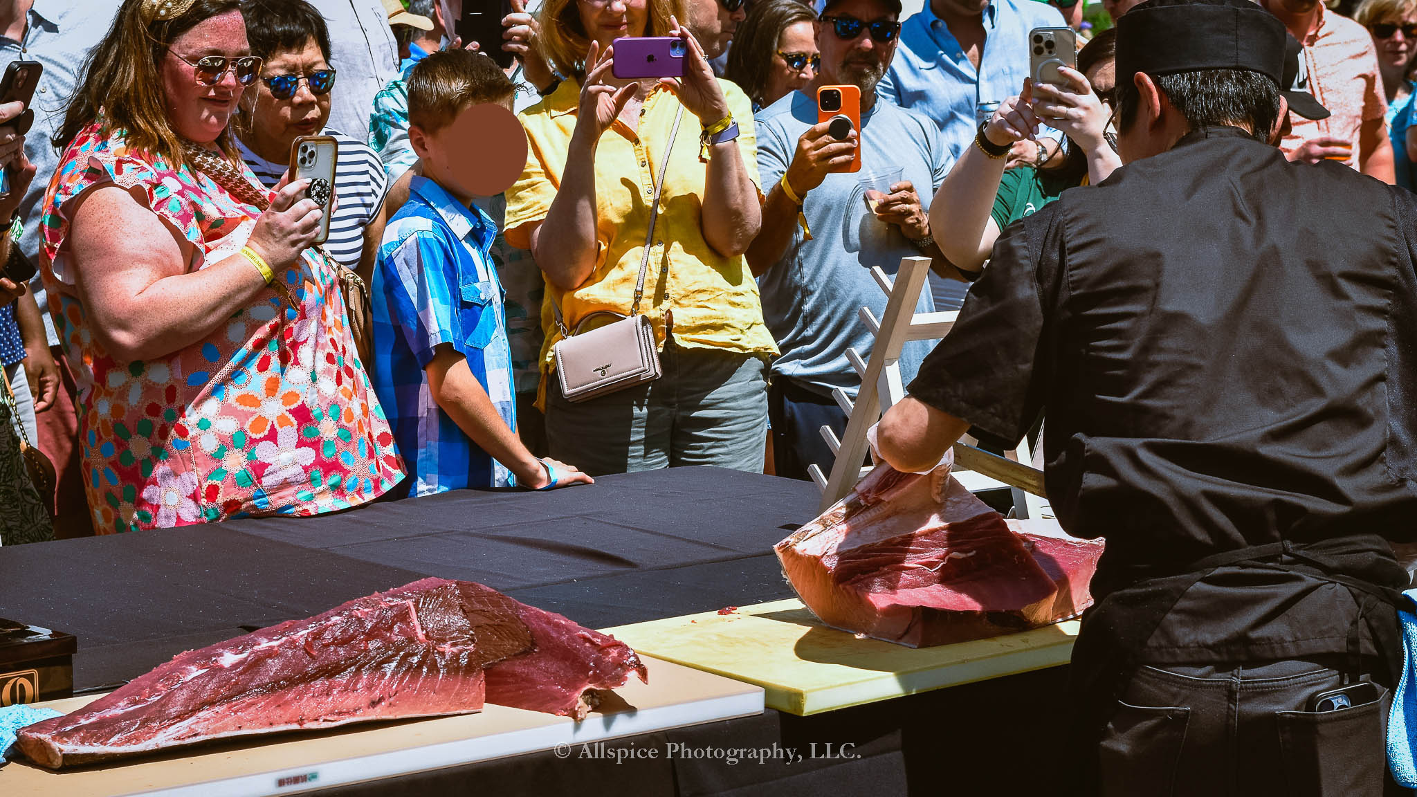 Watching the Live Tuna Cutting from Sushi Yama Travelers Rest at Souther Roots Reunion. Taken by Allspice Photography, LLC.