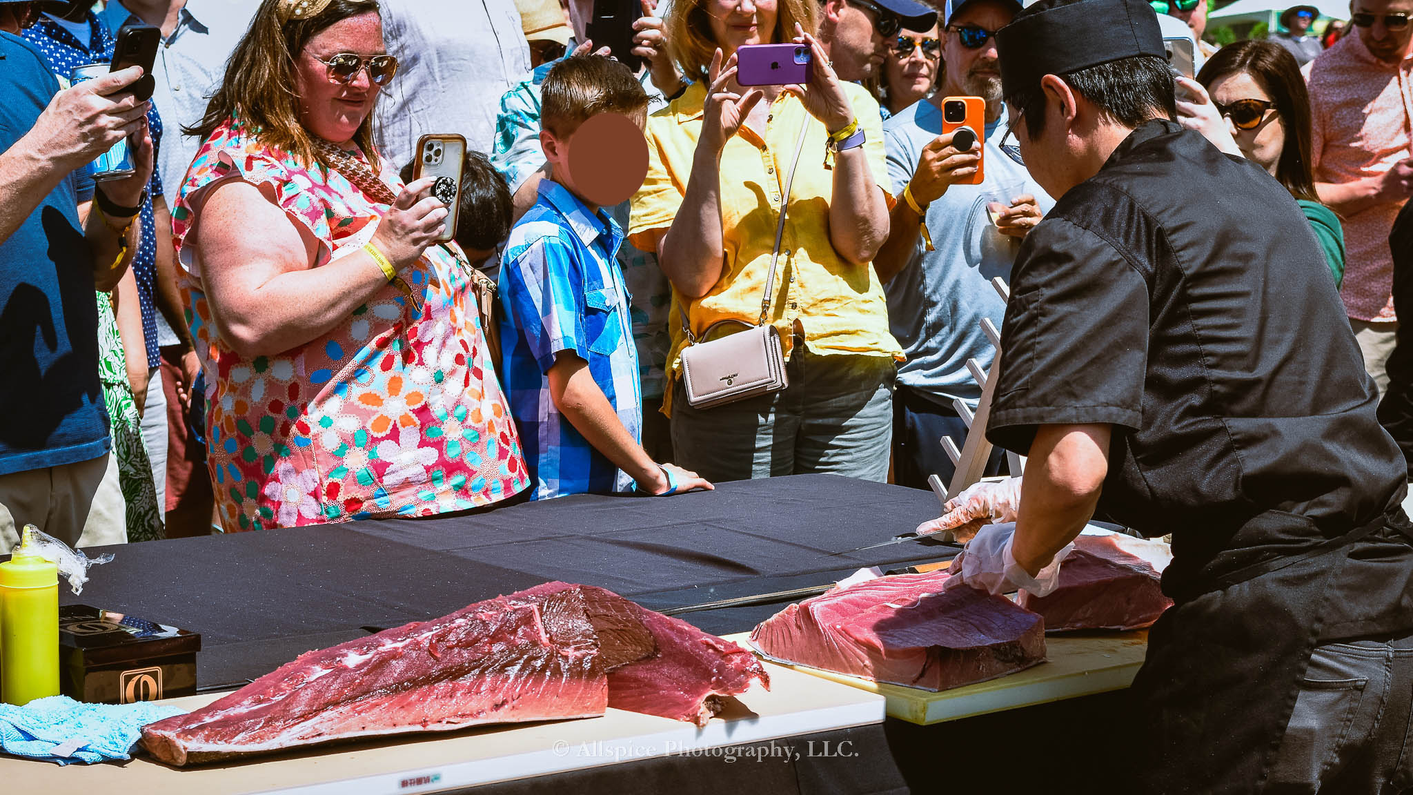 Watching the Live Tuna Cutting from Sushi Yama Travelers Rest at Souther Roots Reunion. Taken by Allspice Photography, LLC.