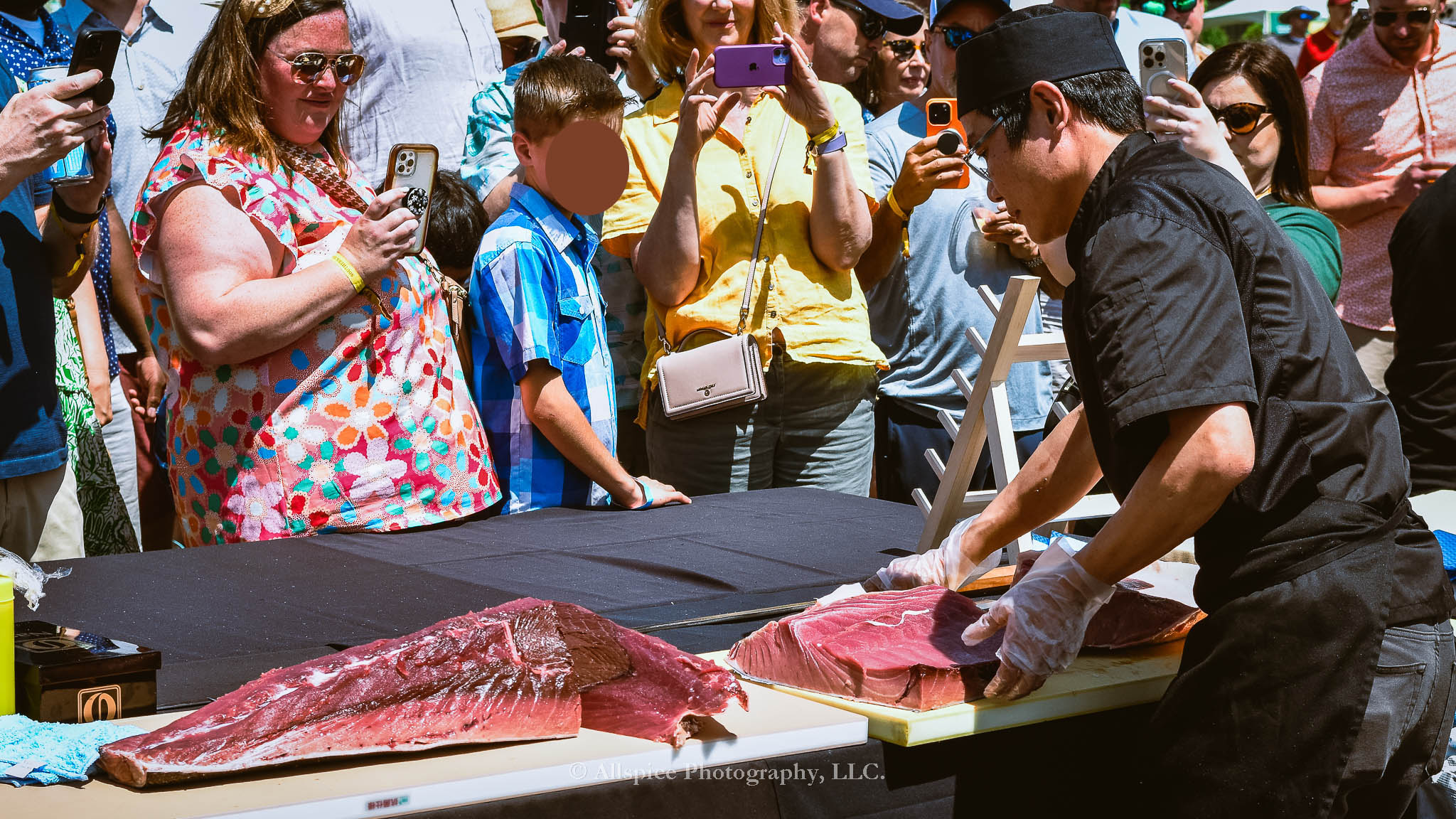 Watching the Live Tuna Cutting from Sushi Yama Travelers Rest at Souther Roots Reunion. Taken by Allspice Photography, LLC.