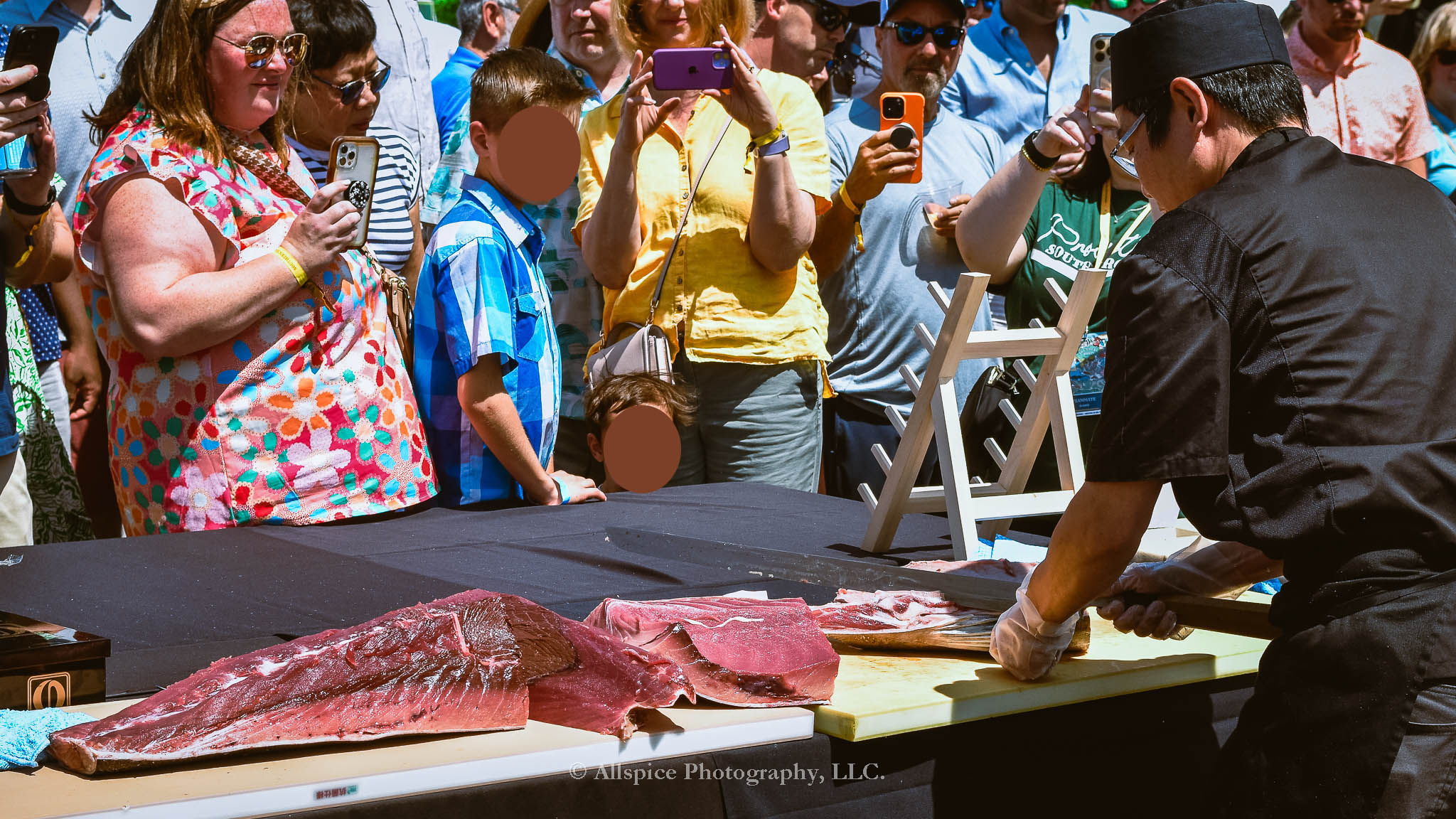 Watching the Live Tuna Cutting from Sushi Yama Travelers Rest at Souther Roots Reunion. Taken by Allspice Photography, LLC.