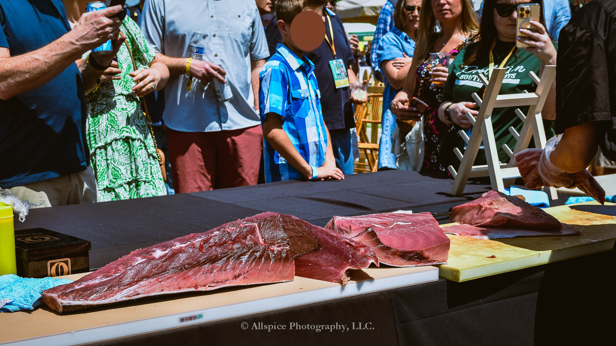 Watching the Live Tuna Cutting from Sushi Yama Travelers Rest at Souther Roots Reunion. Taken by Allspice Photography, LLC.