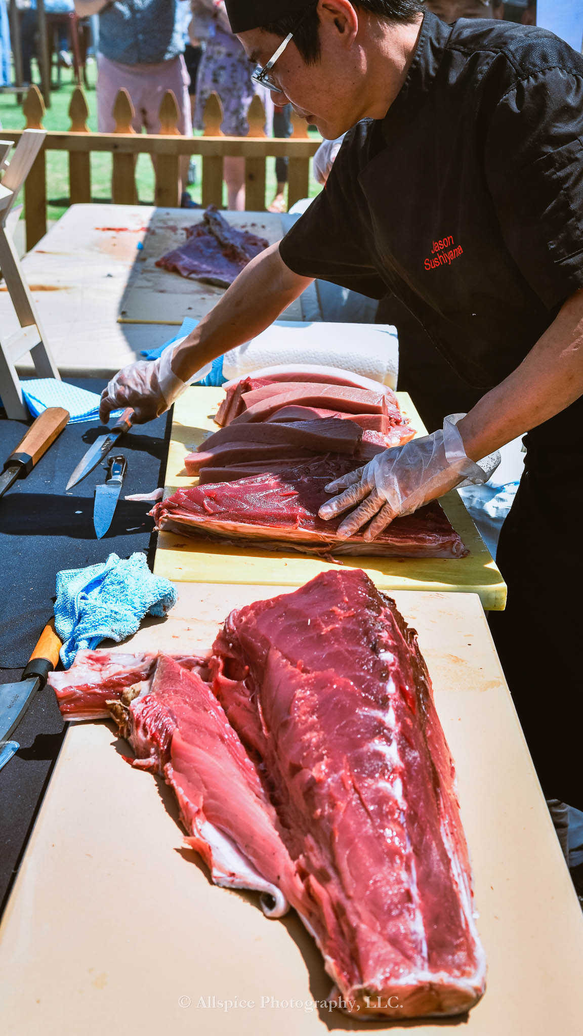 Watching the Live Tuna Cutting from Sushi Yama Travelers Rest at Souther Roots Reunion. Taken by Allspice Photography, LLC.