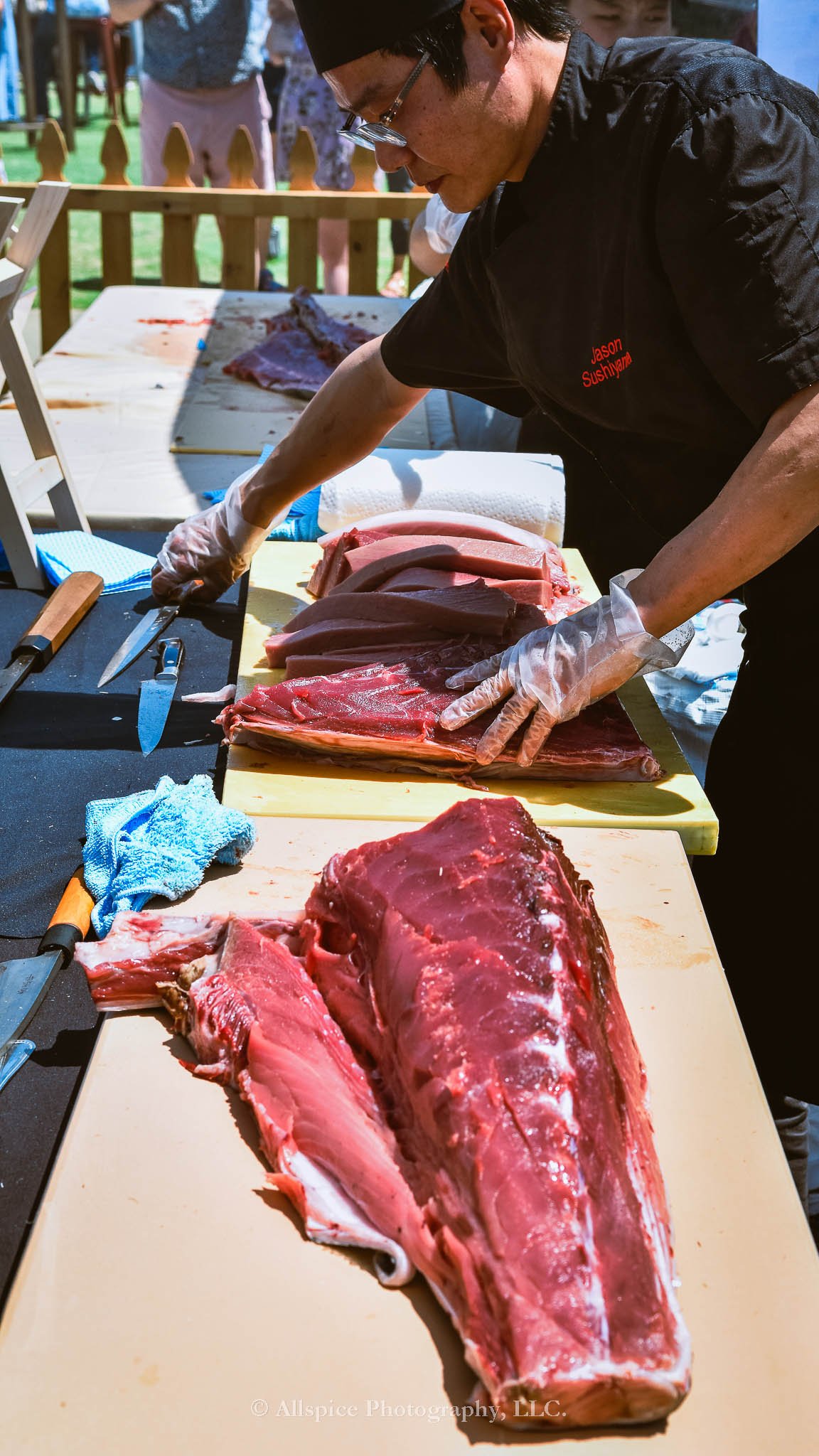 Watching the Live Tuna Cutting from Sushi Yama Travelers Rest at Souther Roots Reunion. Taken by Allspice Photography, LLC.