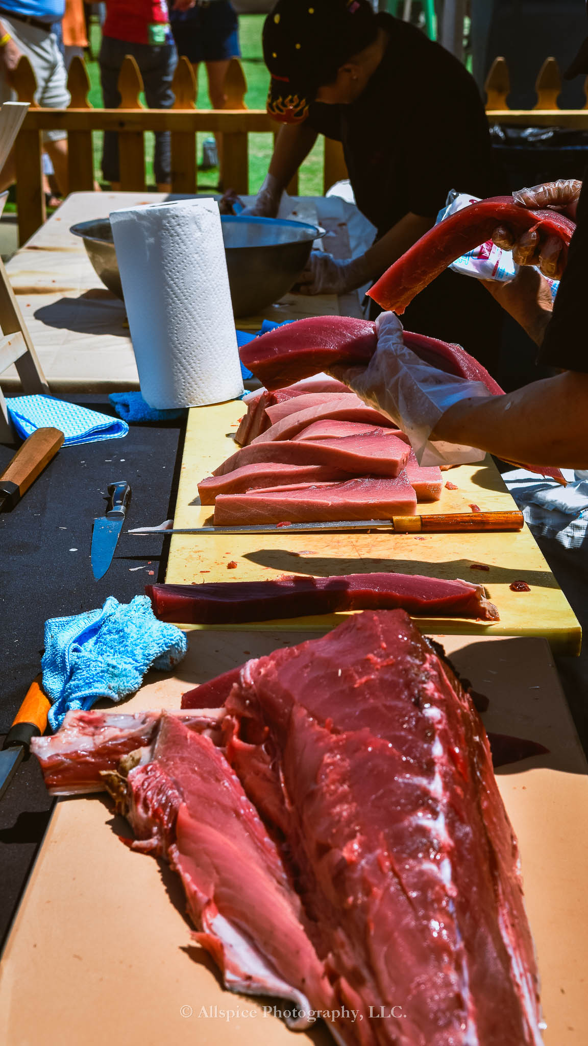 Watching the Live Tuna Cutting from Sushi Yama Travelers Rest at Souther Roots Reunion. Taken by Allspice Photography, LLC.