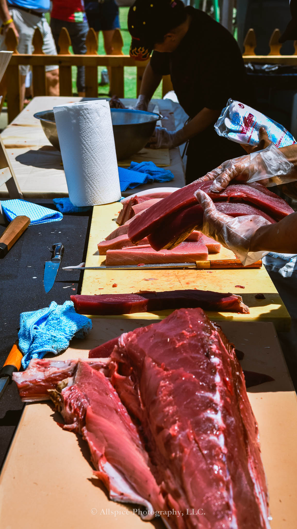 Watching the Live Tuna Cutting from Sushi Yama Travelers Rest at Souther Roots Reunion. Taken by Allspice Photography, LLC.