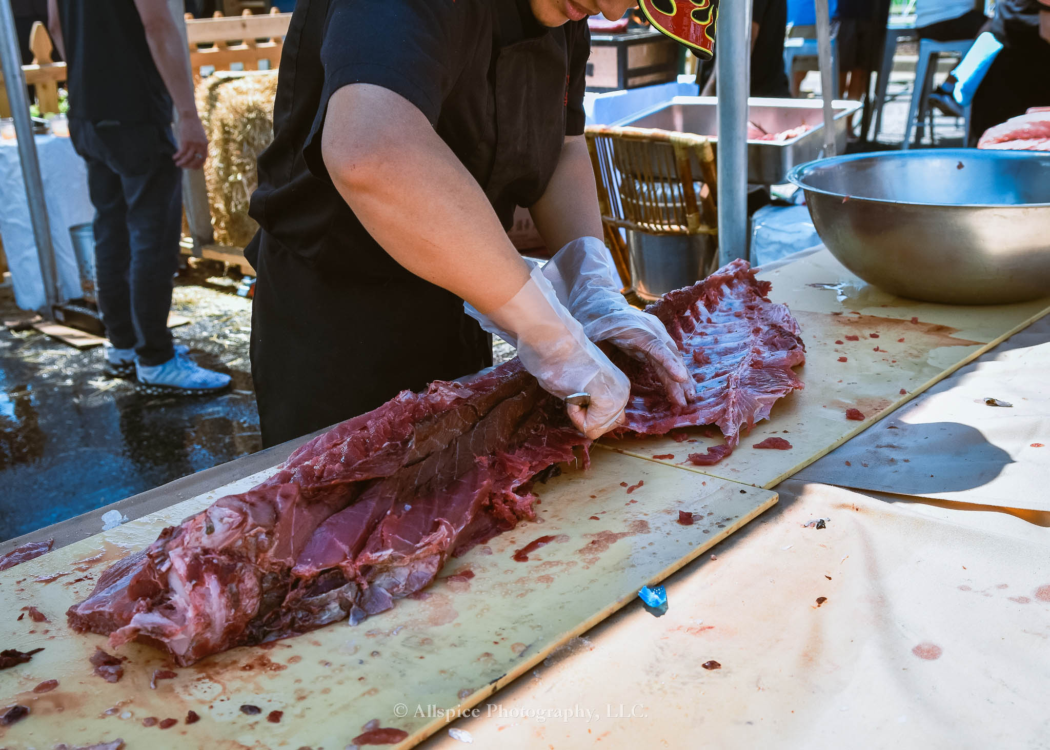 Watching the Live Tuna Cutting from Sushi Yama Travelers Rest at Souther Roots Reunion. Taken by Allspice Photography, LLC.