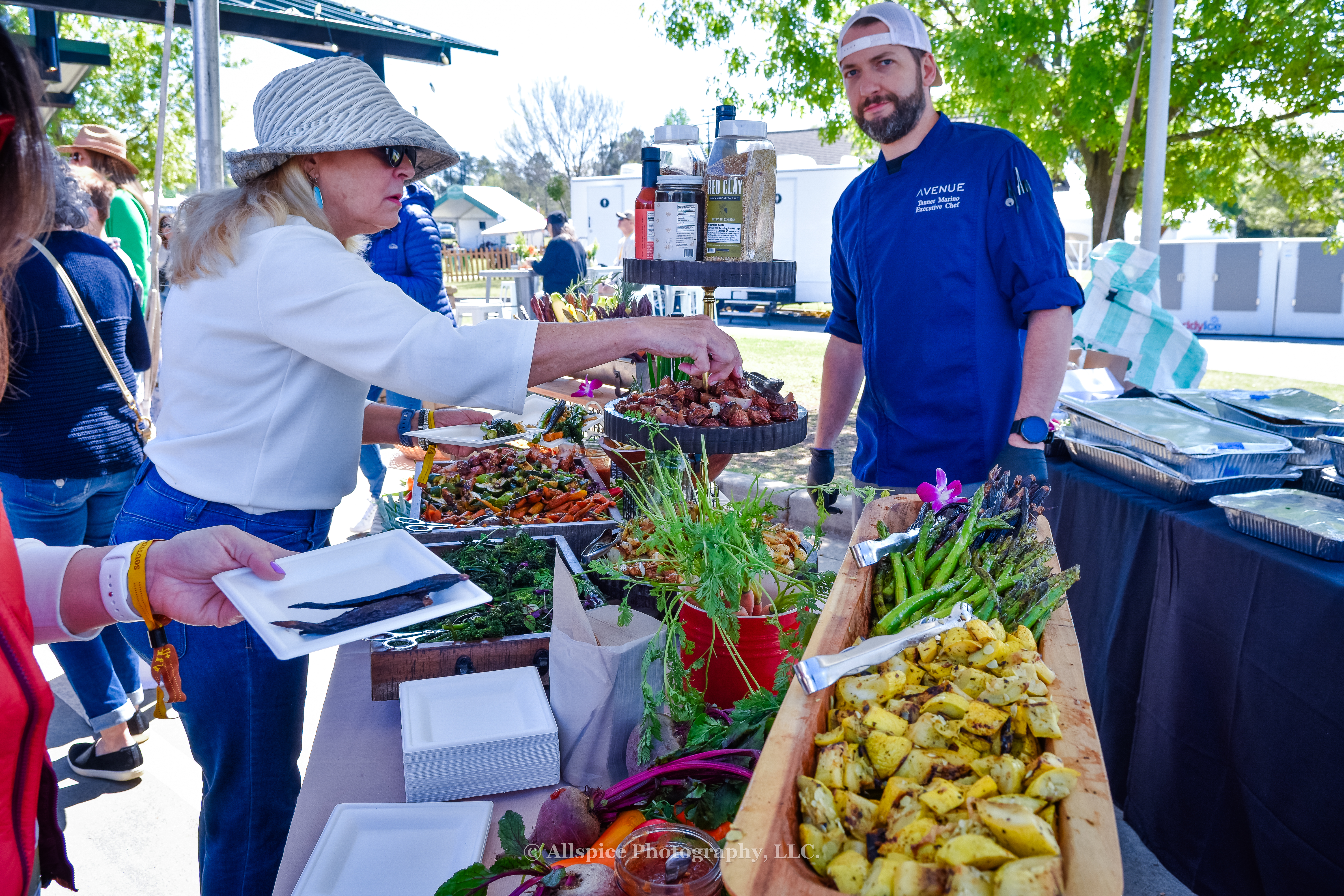 Garden grazing table with fire roasted root vegetables from Chef Tanner Marino and Avenue in the VIP area at Southern Roots Reunion in Travelers Rest, SC. Photo by Allspice Photography, LLC.