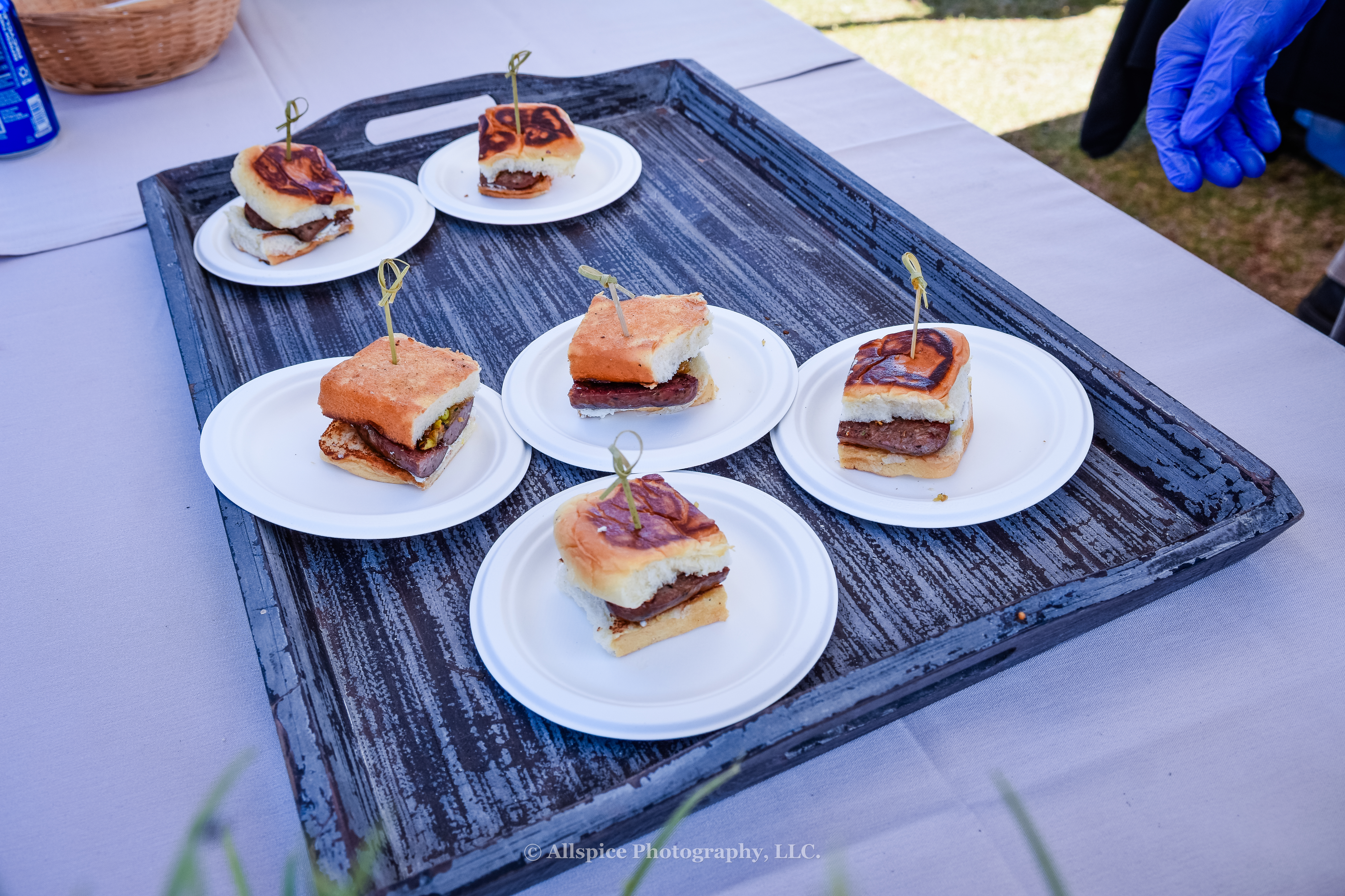 Loukaniko Sausage Sandwich with Lemon Whipped Feta, Golden Raisin Mostarda, and Pistachio Gremolata from Home Team BBQ and Harry's Hoagie Shoppe at Southern Roots Reunion in Travelers Rest, SC. Photo by Allspice Photography, LLC.